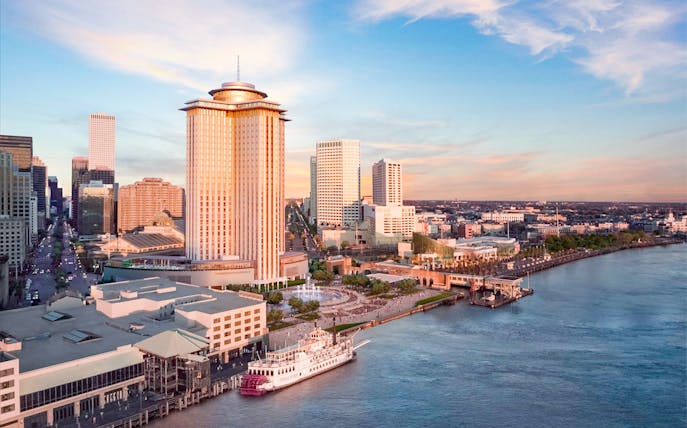 Aerial view of Vue Orleans Observation Deck overlooking New Orleans skyline and Mississippi River.
