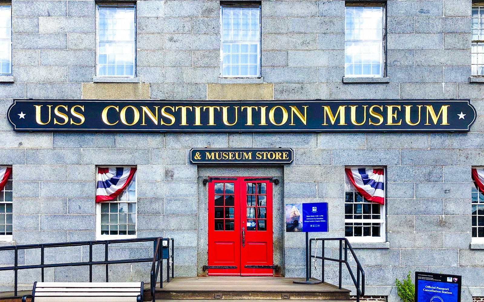USS Constitution Museum entrance with red doors and patriotic bunting.