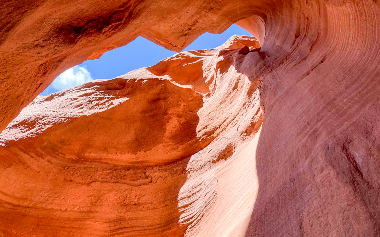 Antelope Valley Canyon rock formations under blue sky on Ligai Si Anii Tour.