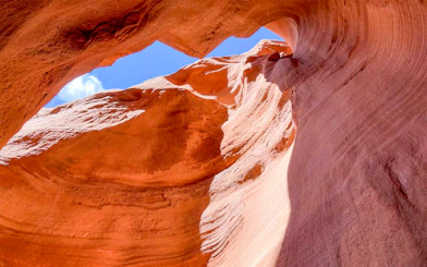 Antelope Valley Canyon rock formations under blue sky on Ligai Si Anii Tour.