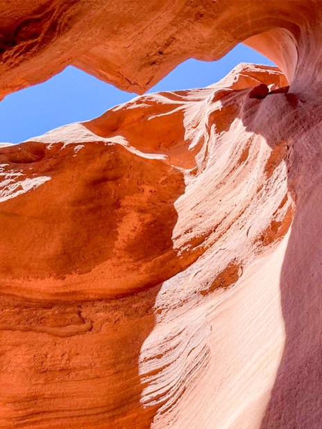 Antelope Valley Canyon rock formations under blue sky on Ligai Si Anii Tour.