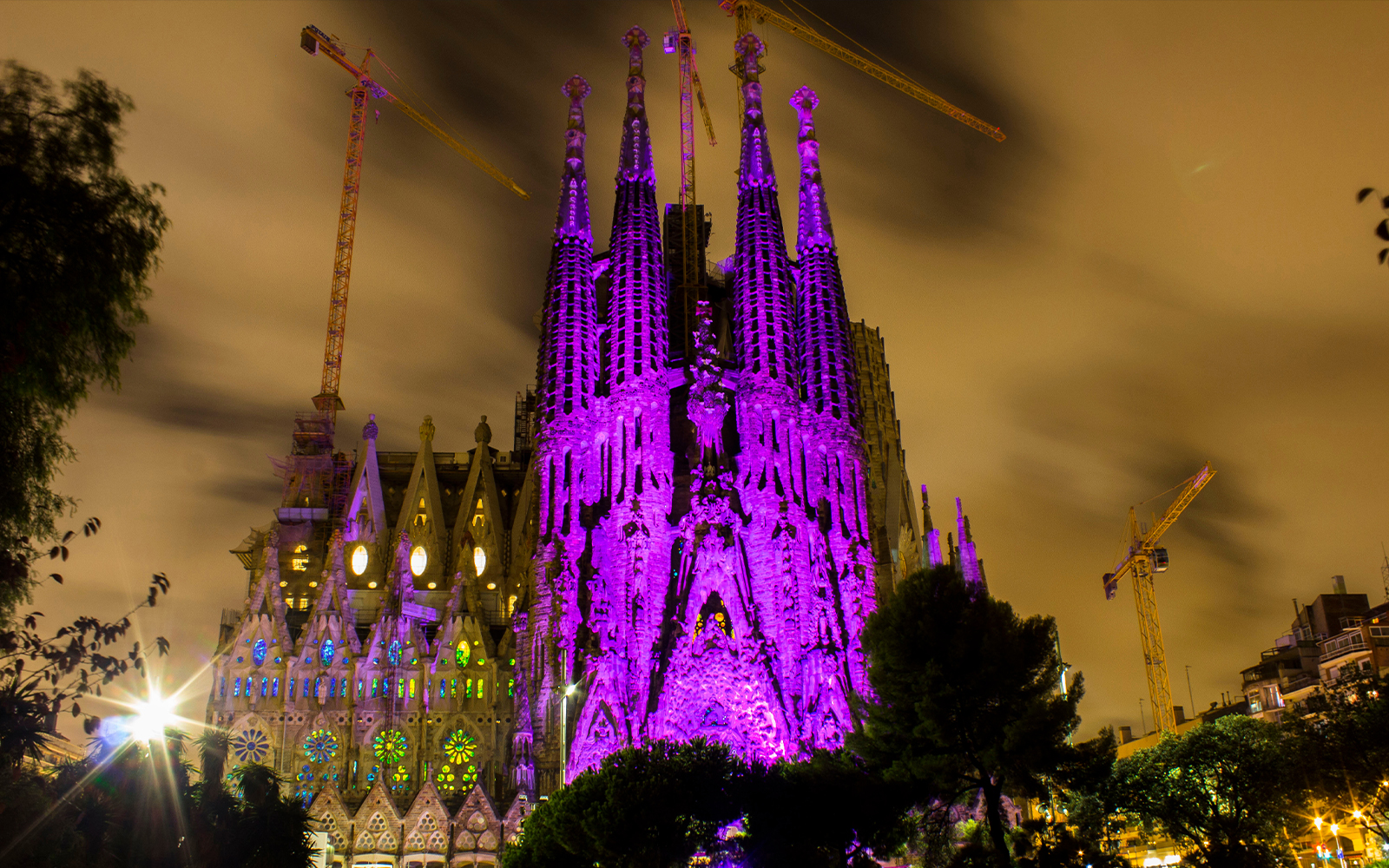 Sagrada Família illuminated in purple at night, long exposure, Barcelona, Spain.