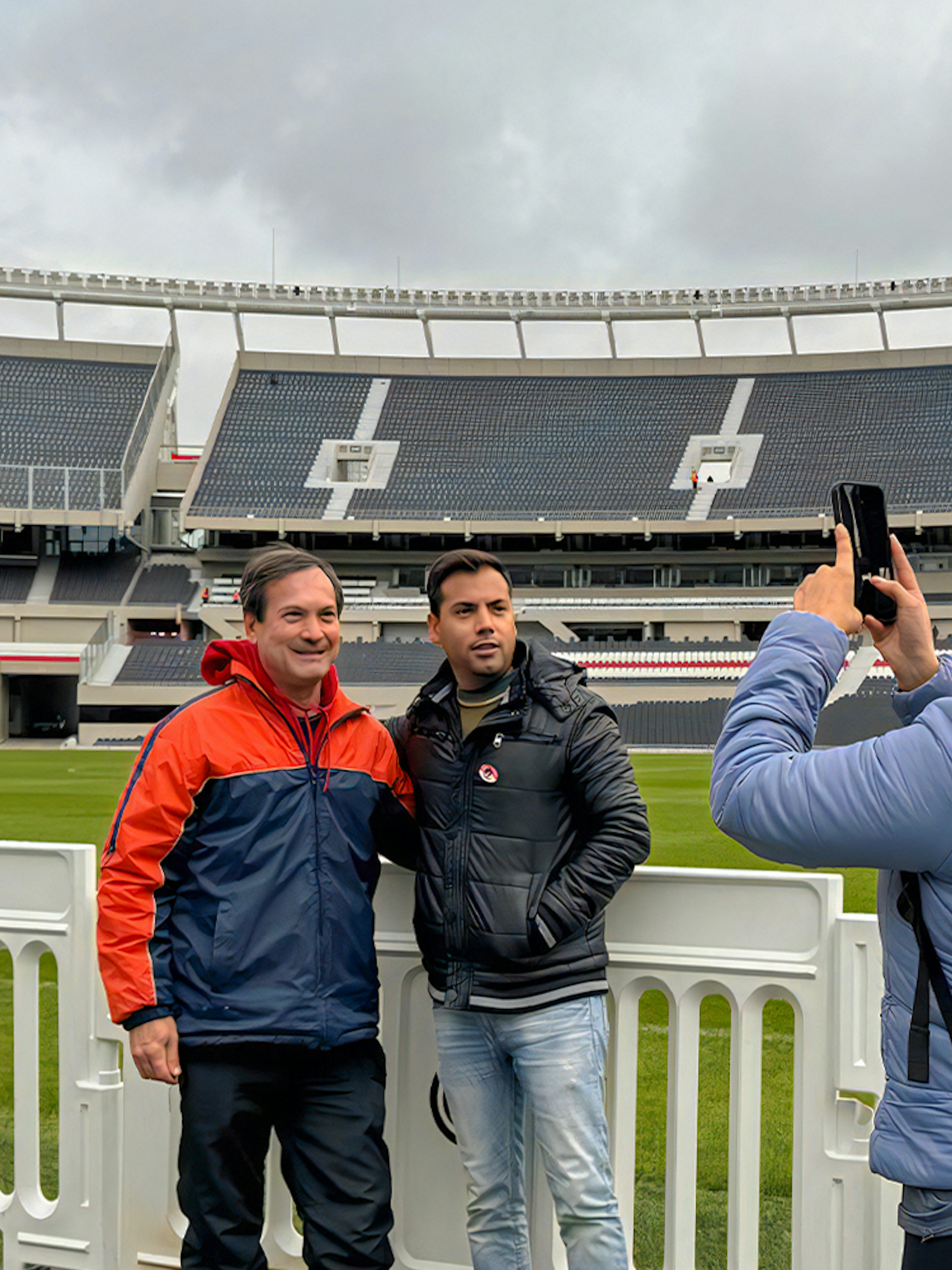 Tourists taking photos at La Bombonera stadium in Buenos Aires.