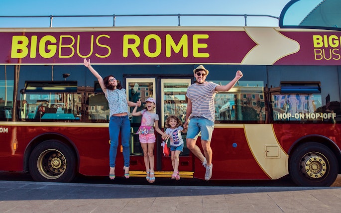 Open-top double-decker bus touring past the Colosseum in Rome, Italy, part of Big Bus Tours Rome.