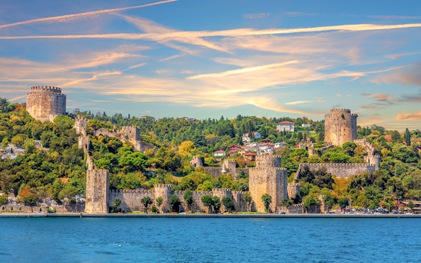 Roumeli Hissar Castle along Bosphorus Strait at sunset, Istanbul, Turkey.