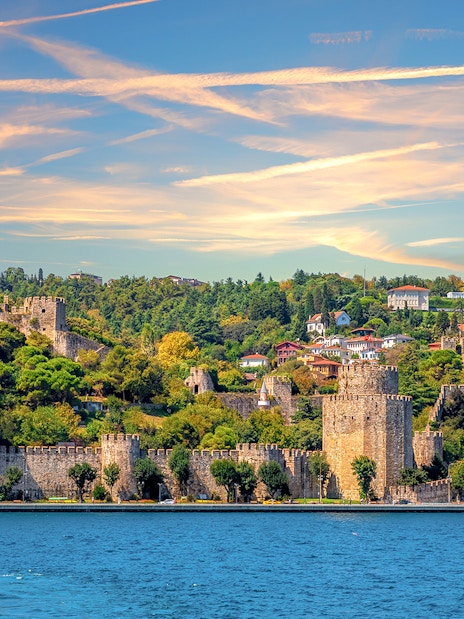 Roumeli Hissar Castle along Bosphorus Strait at sunset, Istanbul, Turkey.