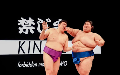 Sumo wrestlers in a match during a training experience in Osaka.