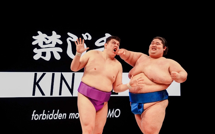 Sumo wrestlers in a match during a training experience in Osaka.