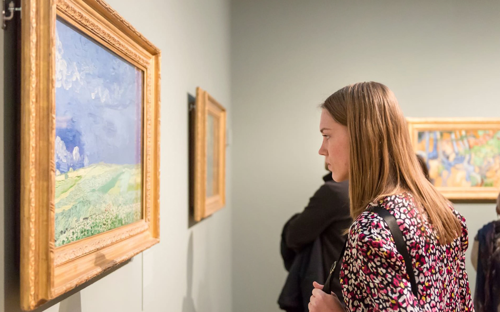 Girl observing Van Gogh painting at the Van Gogh Museum, Amsterdam.