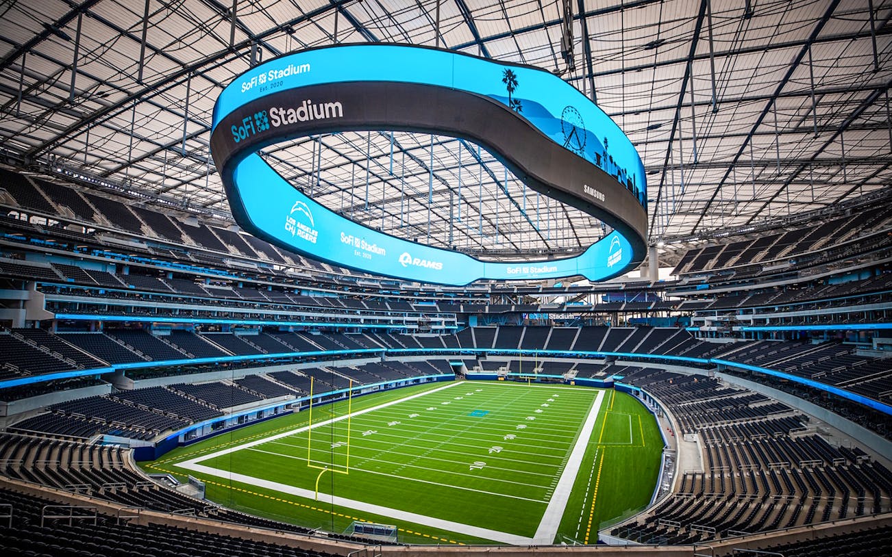 SoFi Stadium interior view from gallery, showcasing field and seating.