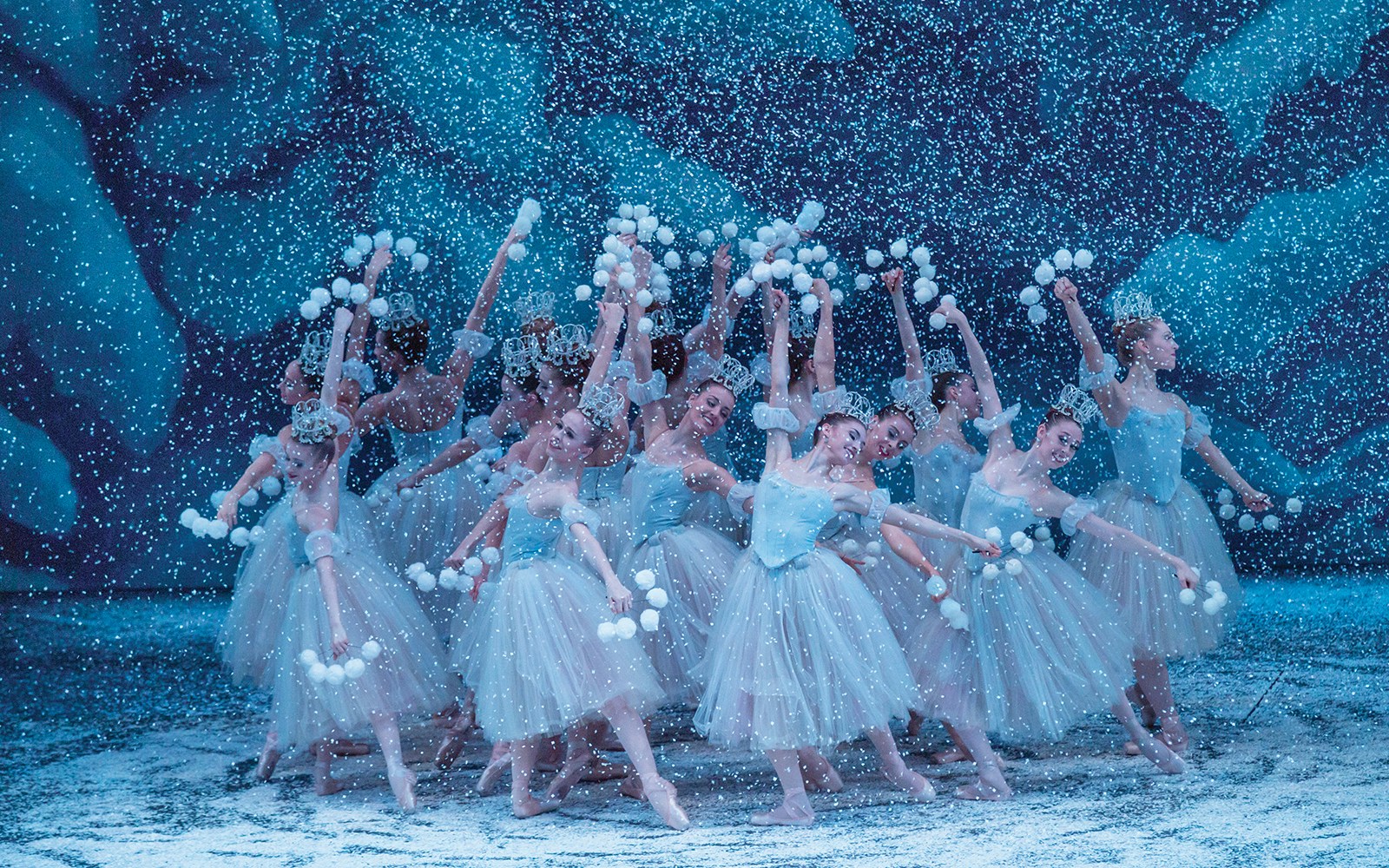 Ballet dancers performing in snow scene from New York City Ballet's The Nutcracker.