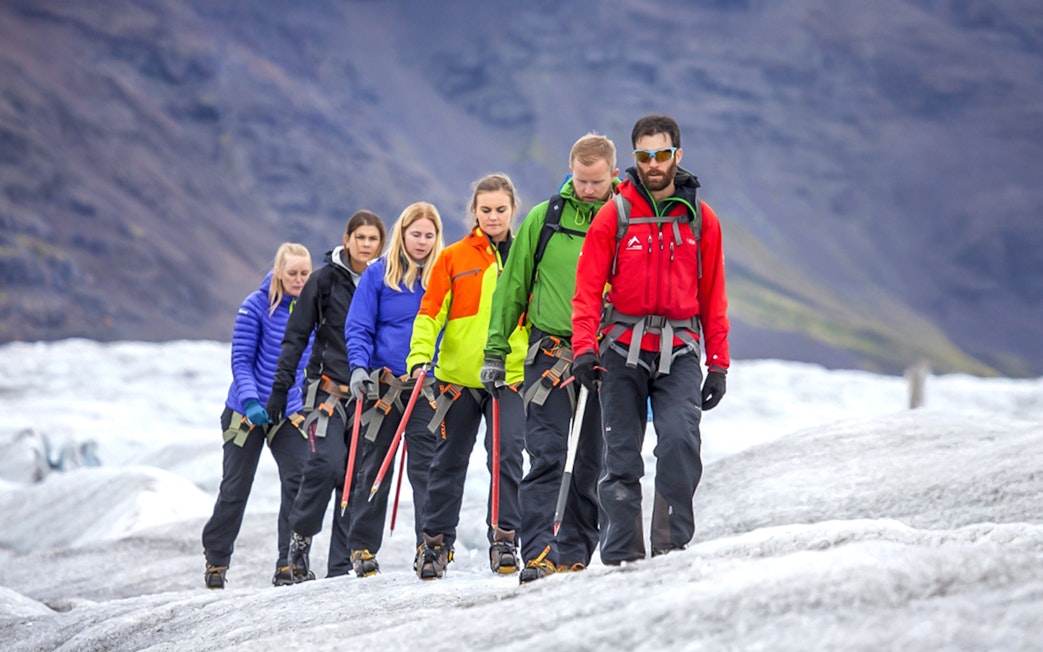 Guests hiking on a glacier in Skaftafell with ice climbing gear.