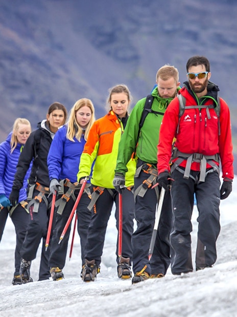 Guests hiking on a glacier in Skaftafell with ice climbing gear.
