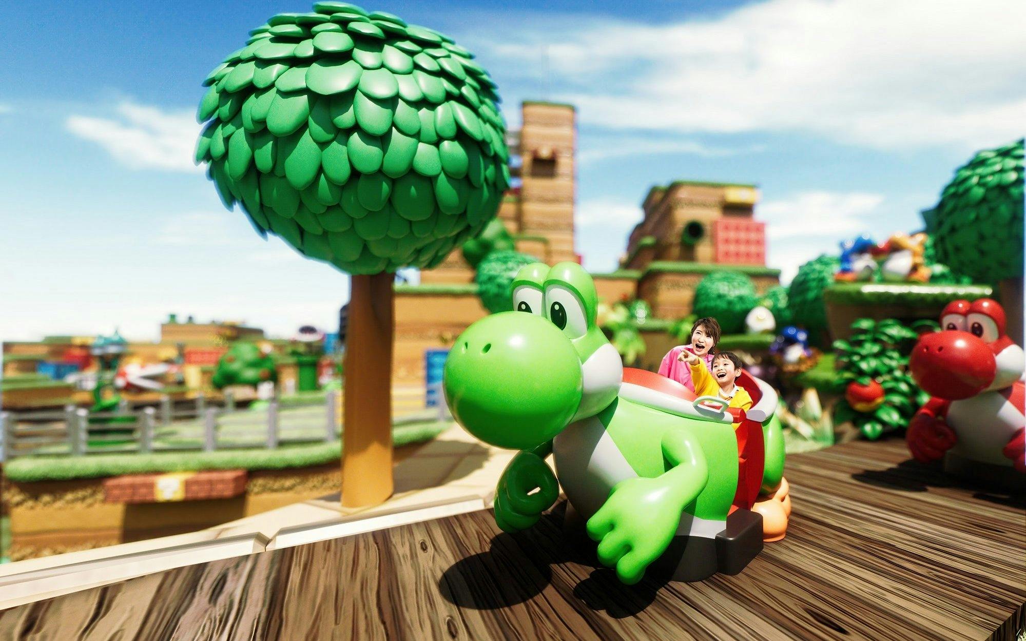 Visitors enjoying Yoshi's Adventure ride at Super Nintendo World, Universal Studios Japan.