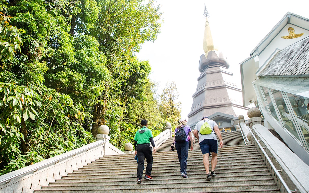 Tour group climbing stairs to Royal Twin Pagoda, Doi Inthanon National Park.