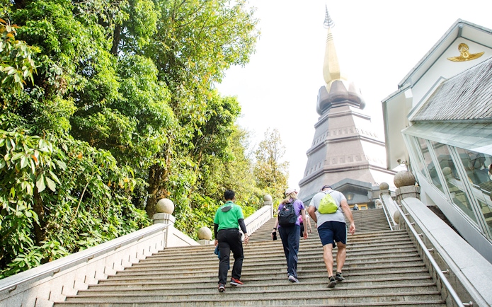 Tour group climbing stairs to Royal Twin Pagoda, Doi Inthanon National Park.