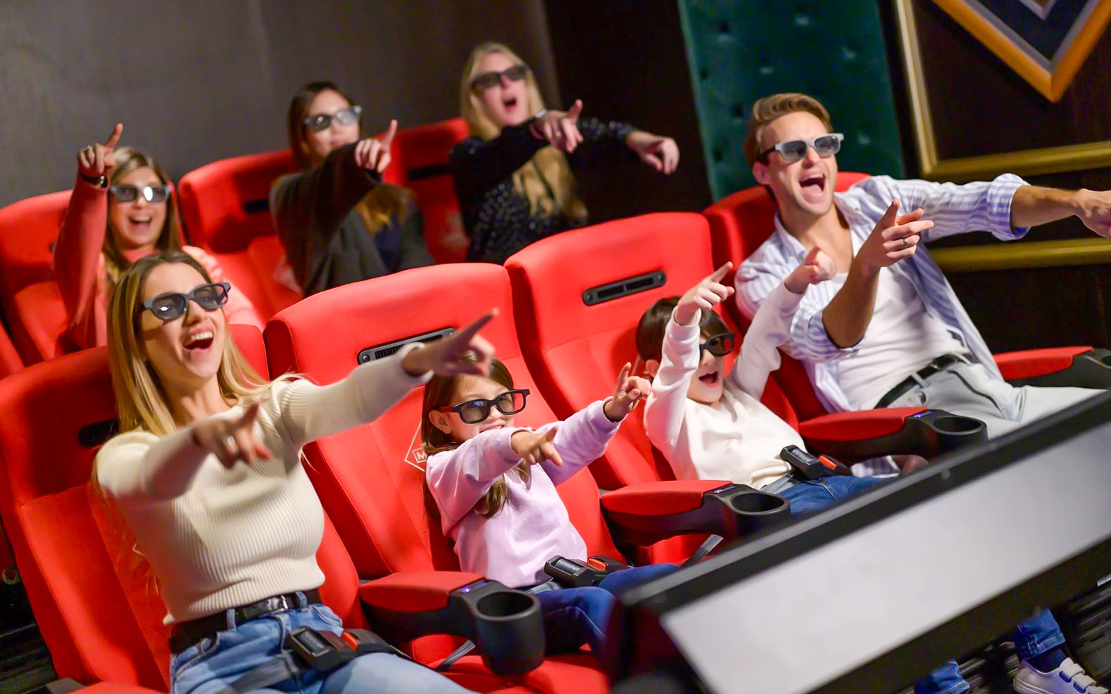 Visitors enjoying a 4D cinema experience at Monopoly Dreams Melbourne.