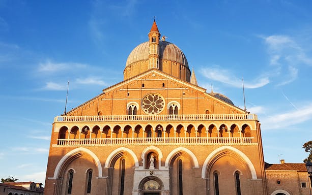 Basilica of Saint Anthony in Padua under a clear blue sky.