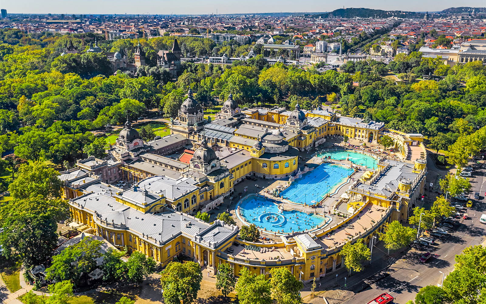 Szechenyi Bath thermal pools in Budapest with people enjoying the warm waters