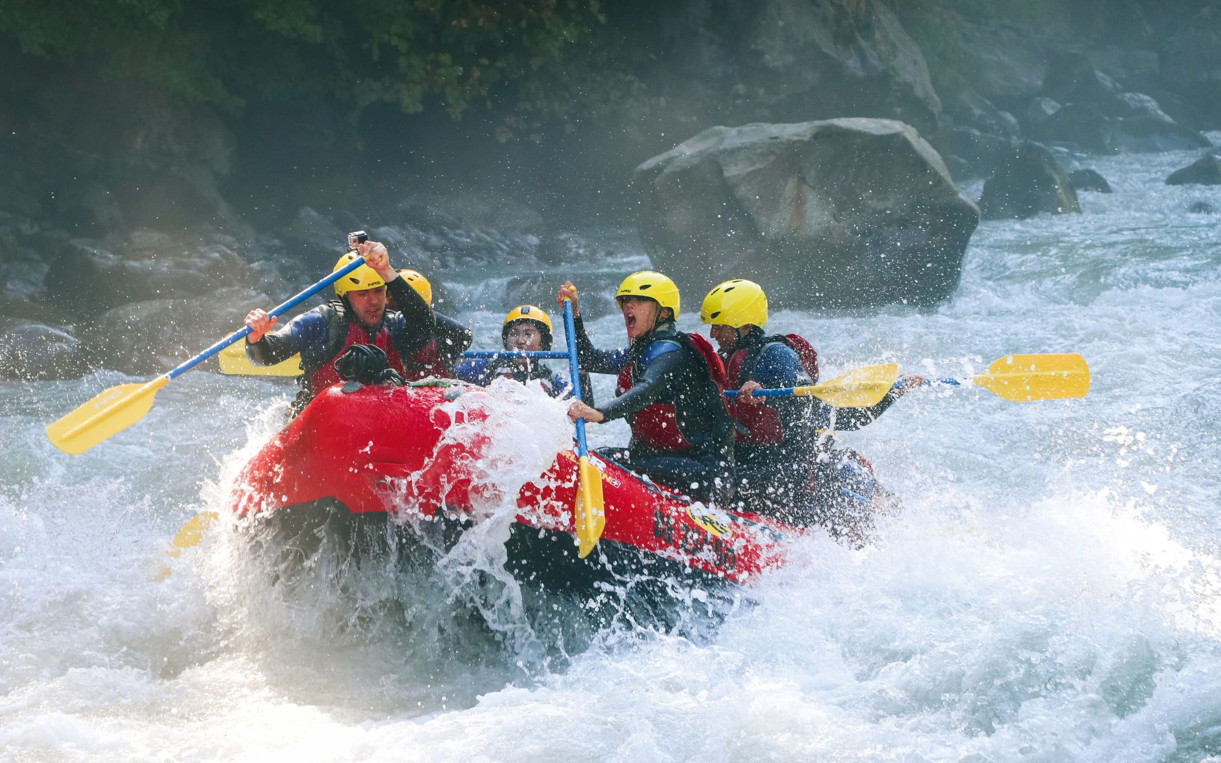 Group river rafting on a rapid in Interlaken, Switzerland.