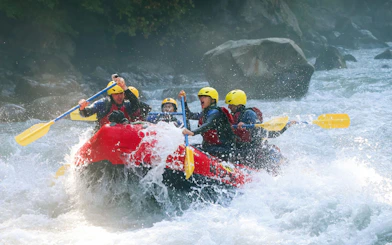 Group river rafting on a rapid in Interlaken, Switzerland.