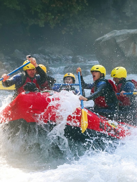 Group river rafting on a rapid in Interlaken, Switzerland.