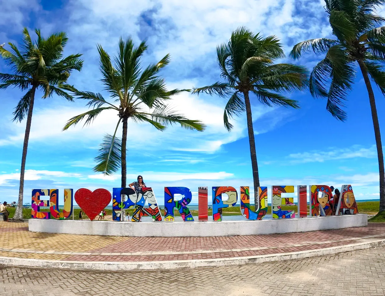 Paripueira Beach sign with palm trees, Maceió, Brazil.