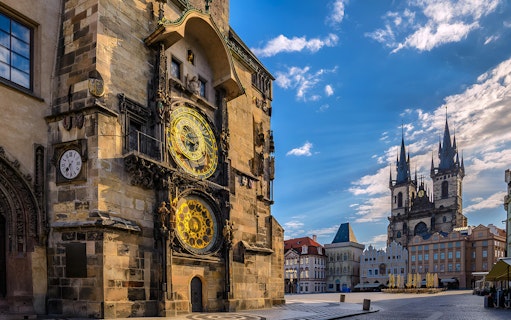 Astronomical Clock and Church of Our Lady before Týn in Prague's Old Town Square.
