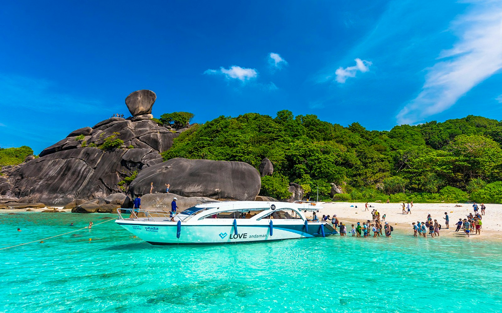 Speedboat at Similan Islands beach with tourists, Love Andaman tour.
