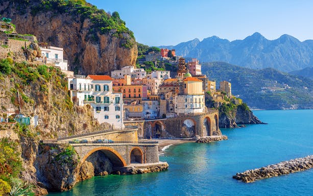 Colorful cliffside buildings overlooking the sea in Sorrento, Italy.