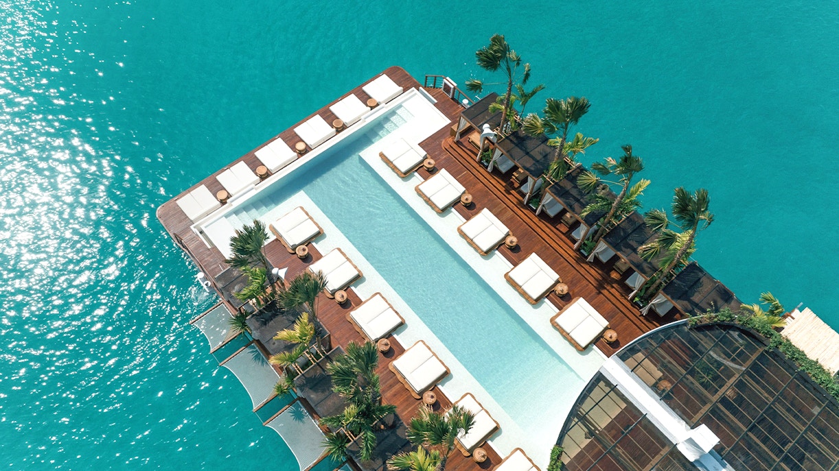 Private cabana at Yona Beach Club Experience in Phuket, overlooking the serene beach and crystal clear waters