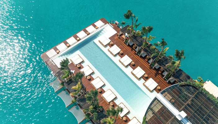 Private cabana at Yona Beach Club Experience in Phuket, overlooking the serene beach and crystal clear waters