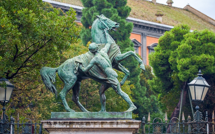 Statue of man and horse in Garden of Royal Palace, Naples.