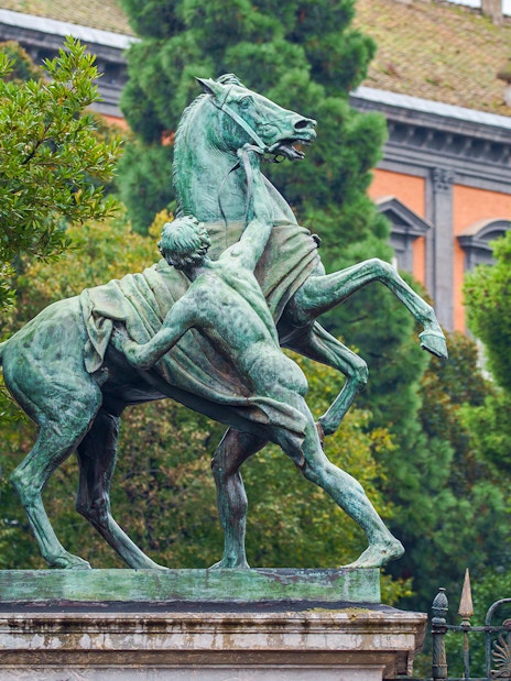 Statue of man and horse in Garden of Royal Palace, Naples.