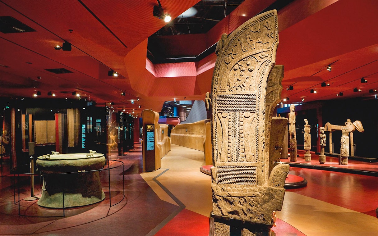 Quai Branly Museum interior with ancient artifacts, Paris.