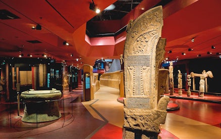 Quai Branly Museum interior with ancient artifacts, Paris.