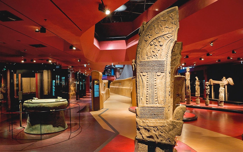 Quai Branly Museum interior with ancient artifacts, Paris.