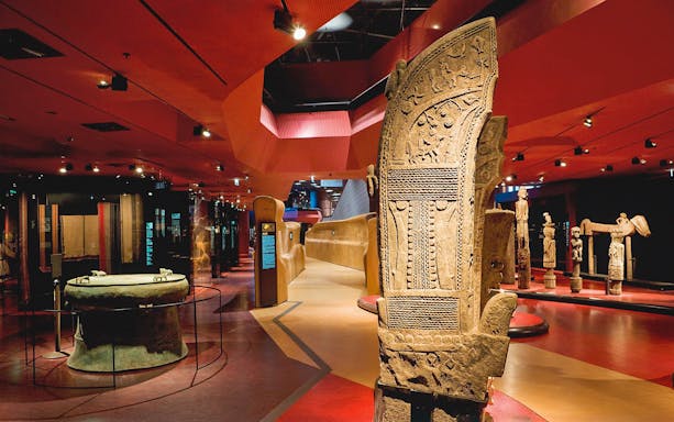 Quai Branly Museum interior with ancient artifacts, Paris.
