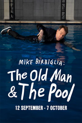 Comedian Mike Birbiglia performing "The Old Man & the Pool" show in New York City theater.