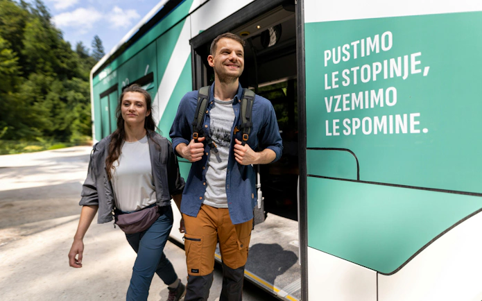 Visitors exiting a shuttle bus near Vintgar Gorge, Bled.