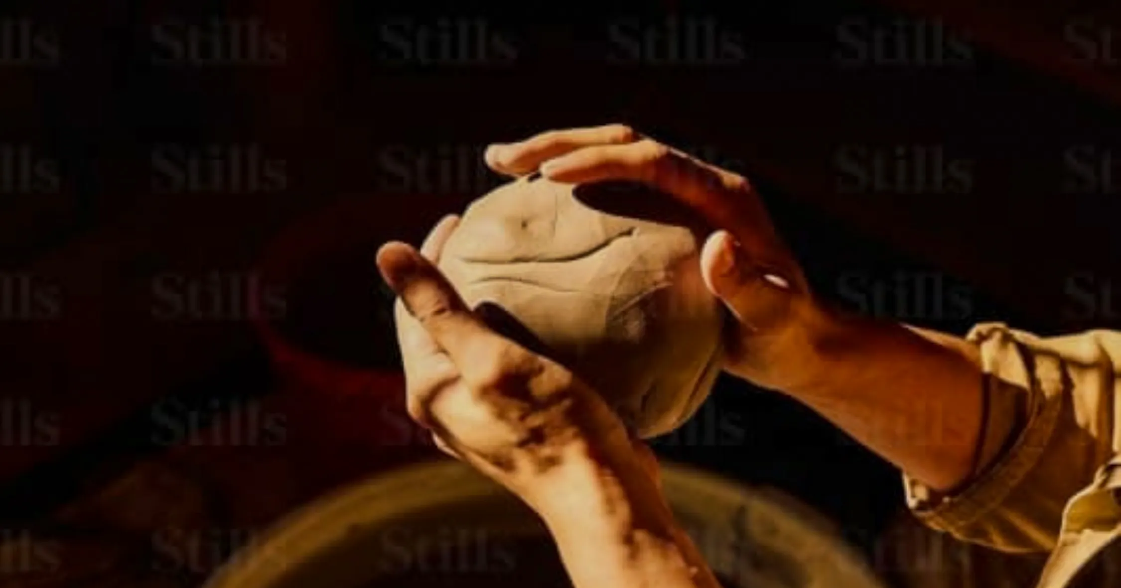 Hands shaping clay at an ancestral pottery workshop near Essaouira.