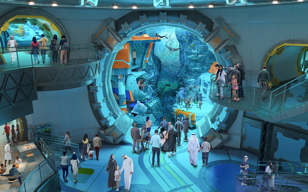 Visitors exploring underwater exhibits at Sea World Abu Dhabi.