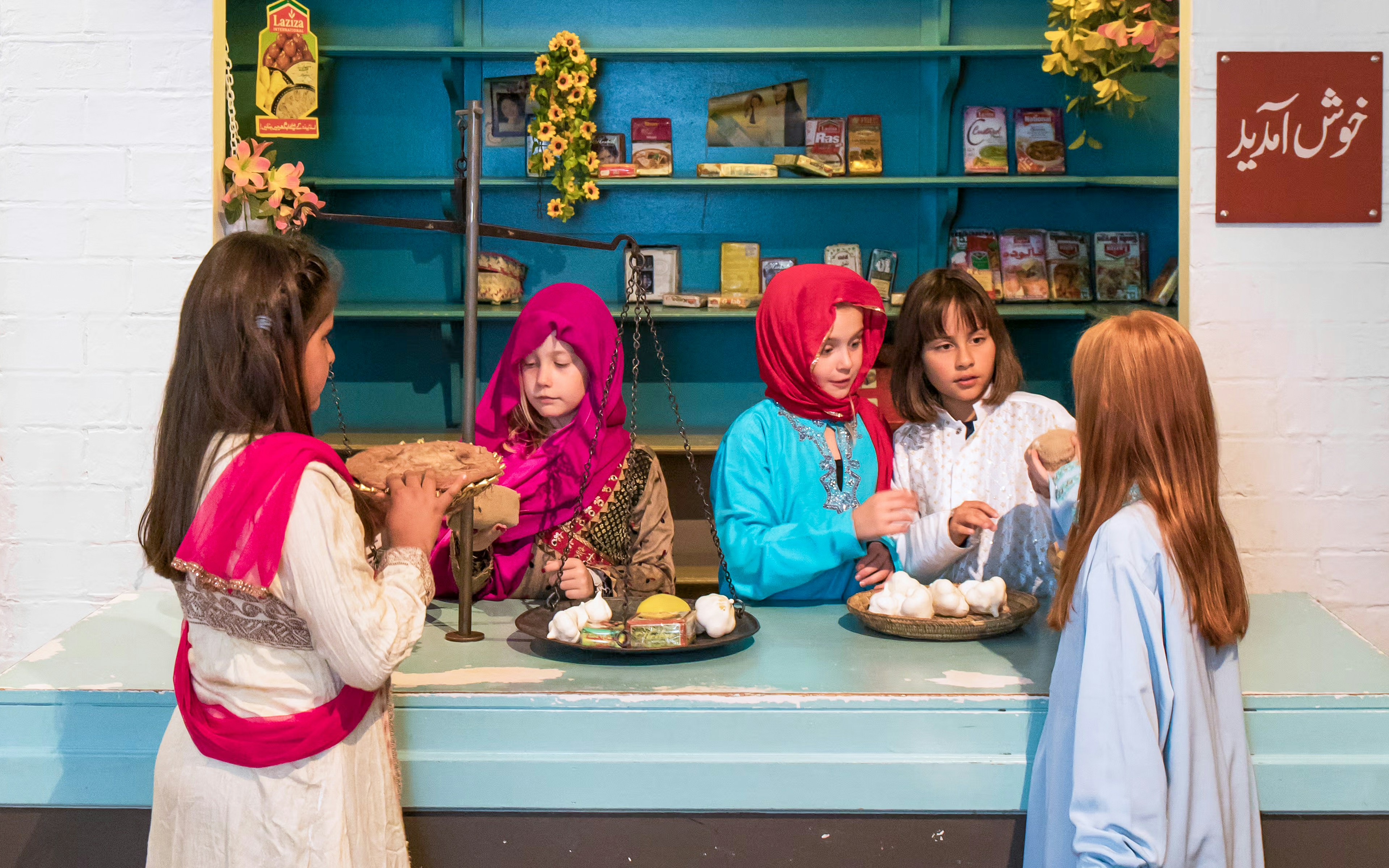 Children engaging in a cultural exhibit at the National Museum of Denmark.