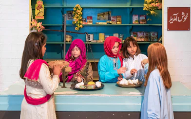 Children engaging in a cultural exhibit at the National Museum of Denmark.