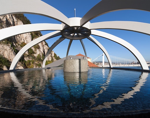 Rooftop pool at Rudas Bath in Budapest with panoramic city views.