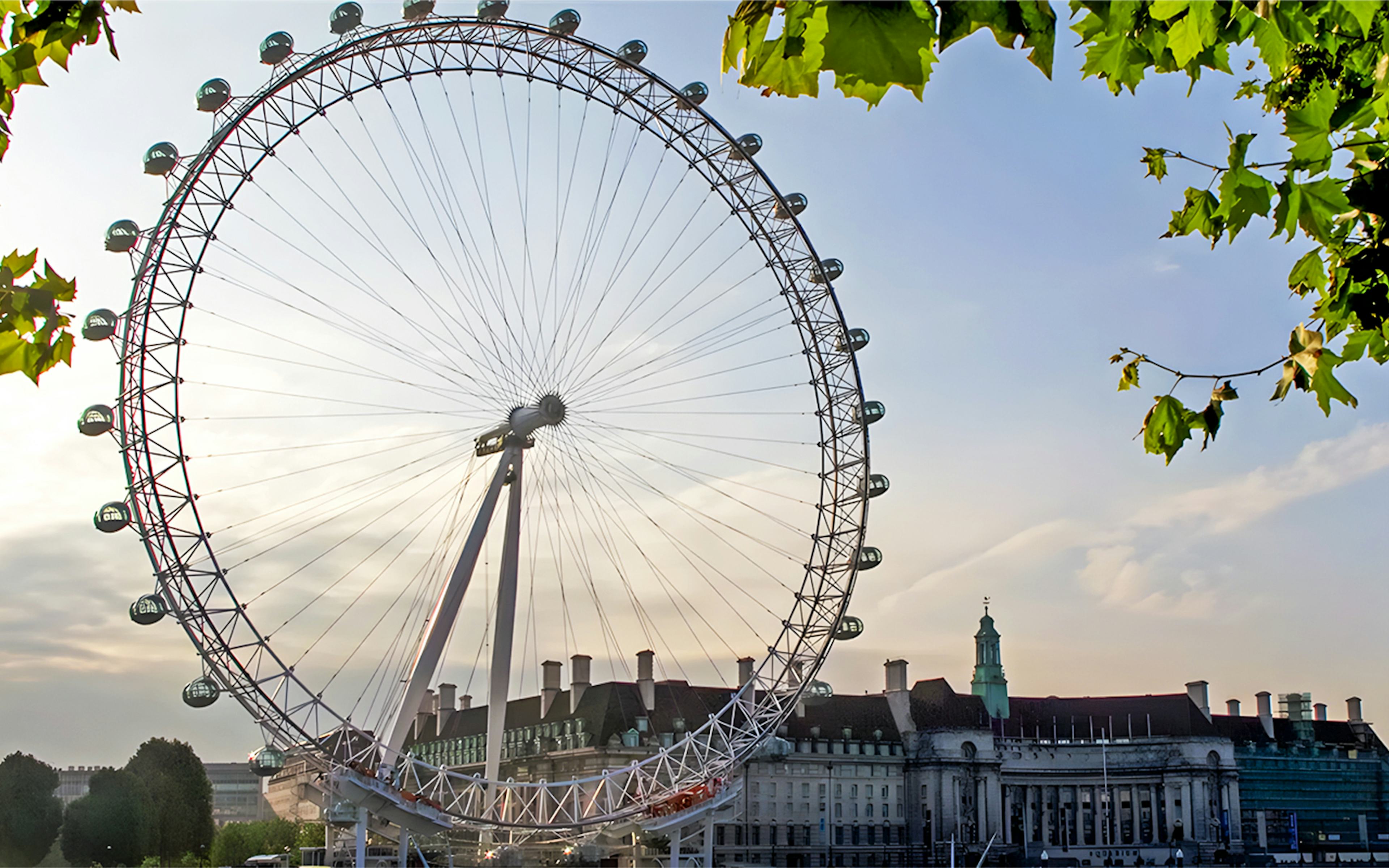 London Eye with nearby buildings, viewed during afternoon tea experience.