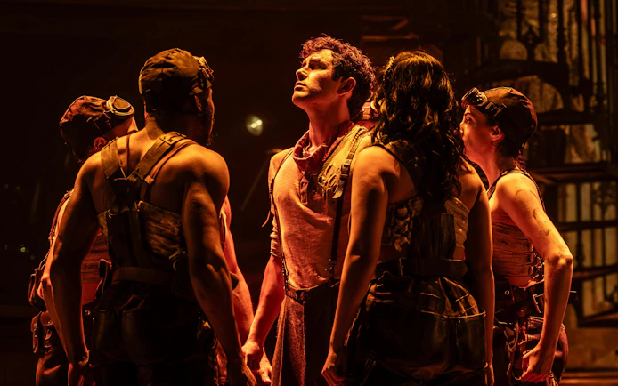 Performers on stage during Hadestown show, West End.