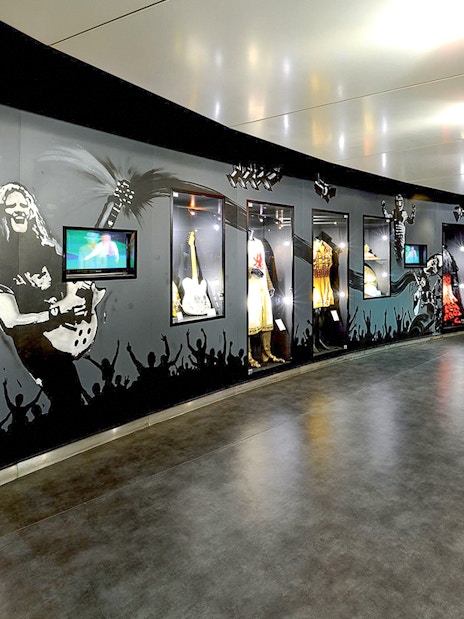 Museum exhibit with costumes and memorabilia at Stade de France, Paris.