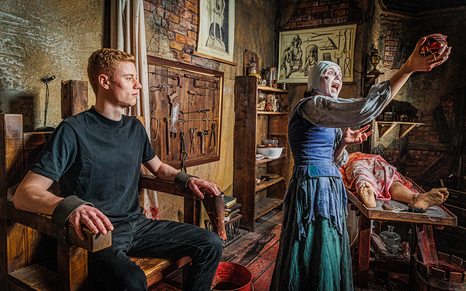 Plague doctor scene at Berlin Dungeon with historical medical tools and actors.