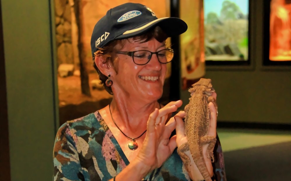 Person holding a lizard at Crocosaurus Cove, Australia.